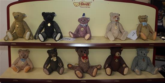 A collection of ten Century of Steiff porcelain bears with buttons in ears and jointed limbs, with display shelf